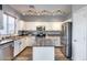 Modern kitchen features white cabinetry, stainless appliances, and an island at 2531 W Saint Catherine Ave, Phoenix, AZ 85041