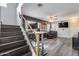 Inviting living room with wood floors and open floor plan, connected to staircase at 2531 W Saint Catherine Ave, Phoenix, AZ 85041
