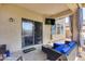 Relaxing covered patio with comfortable seating and sliding glass door access to the home at 2531 W Saint Catherine Ave, Phoenix, AZ 85041