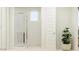 Bright bathroom features glass-enclosed shower and modern fixtures, offering a clean and minimalist design at 25437 N 176Th Ave, Surprise, AZ 85387