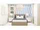 Cozy bedroom showcasing a patterned wallpaper, a stylish chandelier, and a well-lit interior at 25437 N 176Th Ave, Surprise, AZ 85387