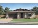 Charming single-story home with a well-manicured lawn and a two-car garage, complete with desert landscaping at 25437 N 176Th Ave, Surprise, AZ 85387