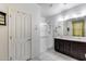 Clean, bright bathroom features dual sinks, a glass-enclosed shower, and ample vanity storage at 2704 S 172Nd Ln, Goodyear, AZ 85338