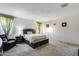 Spacious bedroom filled with natural light featuring neutral colors and a comfortable seating area at 2704 S 172Nd Ln, Goodyear, AZ 85338
