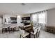 Open-concept kitchen and dining area with modern appliances, granite countertops, and ample seating at 2704 S 172Nd Ln, Goodyear, AZ 85338
