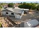 Aerial view of backyard with sheds, garden, hot tub, privacy fence, and patio at 2726 W Meseto Cir, Mesa, AZ 85202