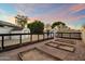 Large backyard with multiple storage structures, garden boxes and privacy fence at 2726 W Meseto Cir, Mesa, AZ 85202