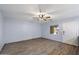 Bedroom with wood-look flooring, ceiling fan and bright window at 2726 W Meseto Cir, Mesa, AZ 85202