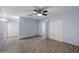 Spacious bedroom with wood-look floors and ample closet space at 2726 W Meseto Cir, Mesa, AZ 85202