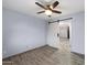 Bedroom featuring wood-look floors and a sliding barn door at 2726 W Meseto Cir, Mesa, AZ 85202