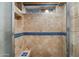 Walk-in tiled shower with a built-in bench at 2726 W Meseto Cir, Mesa, AZ 85202