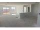Spacious open-concept living area with abundant natural light and a seamless transition to outdoor spaces at 32002 N Pony Express Rd, San Tan Valley, AZ 85143