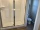 Clean bathroom with glass enclosed shower and modern toilet at 3363 S 180Th Ln, Goodyear, AZ 85338