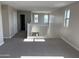 Loft featuring neutral carpet, and a view of the surrounding neighborhood through the large windows at 3363 S 180Th Ln, Goodyear, AZ 85338