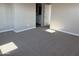Spacious main bedroom featuring plush carpeting and an ensuite bathroom for added privacy at 3363 S 180Th Ln, Goodyear, AZ 85338