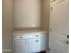Clean storage area featuring pristine white cabinets with a countertop and modern handles at 3363 S 180Th Ln, Goodyear, AZ 85338