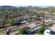 Wide aerial shot showcases the community layout with well-maintained homes, green spaces, and convenient access to the highway at 3444 E Paradise Dr, Phoenix, AZ 85028