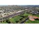 An aerial shot of a neighborhood with convenient access to a highway and a large park with baseball fields at 3444 E Paradise Dr, Phoenix, AZ 85028