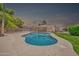 Inviting backyard featuring a large pool, spacious patio, and lush green landscaping at 3444 E Paradise Dr, Phoenix, AZ 85028