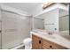 Updated bathroom with a glass shower enclosure and updated vanity at 3444 E Paradise Dr, Phoenix, AZ 85028