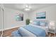 Bedroom featuring wood-look flooring, neutral walls, ceiling fan, and direct access to a window at 3444 E Paradise Dr, Phoenix, AZ 85028