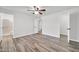Spacious bedroom with wood floors features an ensuite bath and ample closet space for comfortable living at 3444 E Paradise Dr, Phoenix, AZ 85028