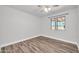 Bright bedroom features hardwood flooring and a large window offering natural light at 3444 E Paradise Dr, Phoenix, AZ 85028