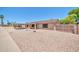 Single-story home with a carport and low maintenance desert landscaping at 3444 E Paradise Dr, Phoenix, AZ 85028