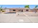 Charming single-story home with a carport and low maintenance desert landscaping at 3444 E Paradise Dr, Phoenix, AZ 85028