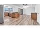 Open concept kitchen/dining room with wood-look flooring, wood cabinets and stainless appliances at 3444 E Paradise Dr, Phoenix, AZ 85028