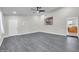Spacious living room features wood-look floors and a ceiling fan at 3444 E Paradise Dr, Phoenix, AZ 85028