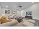 Bright living room boasts neutral colors, hardwood flooring, and recessed lighting at 3444 E Paradise Dr, Phoenix, AZ 85028