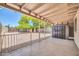 Covered patio overlooking the backyard with storage shed and decorative rock at 3444 E Paradise Dr, Phoenix, AZ 85028