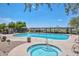 Large community pool and spa area with a shaded pergola offering resort-style amenities and relaxation at 35414 N 32Nd Dr, Phoenix, AZ 85086