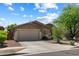 Charming single-story home featuring a well-maintained front yard and a two-car garage at 35414 N 32Nd Dr, Phoenix, AZ 85086