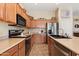 Functional kitchen with stainless steel appliances and warm cabinets at 35414 N 32Nd Dr, Phoenix, AZ 85086