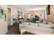 Open concept living room with stylish furniture, a TV, and views into other rooms at 35414 N 32Nd Dr, Phoenix, AZ 85086