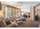 Bright and airy living room open to the kitchen with modern furniture and neutral decor at 35414 N 32Nd Dr, Phoenix, AZ 85086