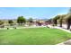 Community playground featuring play structures, green lawns, picnic areas, and recreational facilities for Gathering fun at 35414 N 32Nd Dr, Phoenix, AZ 85086