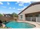 Sparkling backyard pool offers a refreshing oasis with lush landscaping and a privacy fence at 35414 N 32Nd Dr, Phoenix, AZ 85086