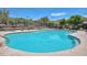 Resort style community pool with sparkling turquoise water and surrounding desert landscaping at 35414 N 32Nd Dr, Phoenix, AZ 85086