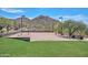 Community sand volleyball court with mountain views surrounded by lush desert landscaping at 35414 N 32Nd Dr, Phoenix, AZ 85086