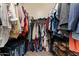 A well-organized walk-in closet with ample storage space for clothes, shoes, and accessories at 35414 N 32Nd Dr, Phoenix, AZ 85086
