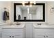 Beautifully renovated bathroom with dual sinks, new lighting fixtures, and a large decorative mirror at 3551 N 12Th St # 101, Phoenix, AZ 85014