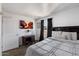 Charming bedroom with a large window, modern bed, and a desk for studying or working from home at 3551 N 12Th St # 101, Phoenix, AZ 85014