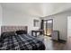 Cozy bedroom with hardwood floors, a slider that goes to the backyard and a mini fridge for convenience at 3551 N 12Th St # 101, Phoenix, AZ 85014