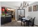 Open concept dining area with modern lighting and adjacent kitchen, leading to an outdoor patio at 3551 N 12Th St # 101, Phoenix, AZ 85014