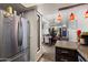 Modern kitchen offering stainless steel refrigerator, adjacent to dining and living areas at 3551 N 12Th St # 101, Phoenix, AZ 85014