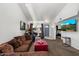 Cozy living room with a large couch, stylish decorations, and a view into other rooms at 3551 N 12Th St # 101, Phoenix, AZ 85014