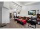 Open-concept living space featuring a large sofa, with views of the kitchen and dining area at 3551 N 12Th St # 101, Phoenix, AZ 85014